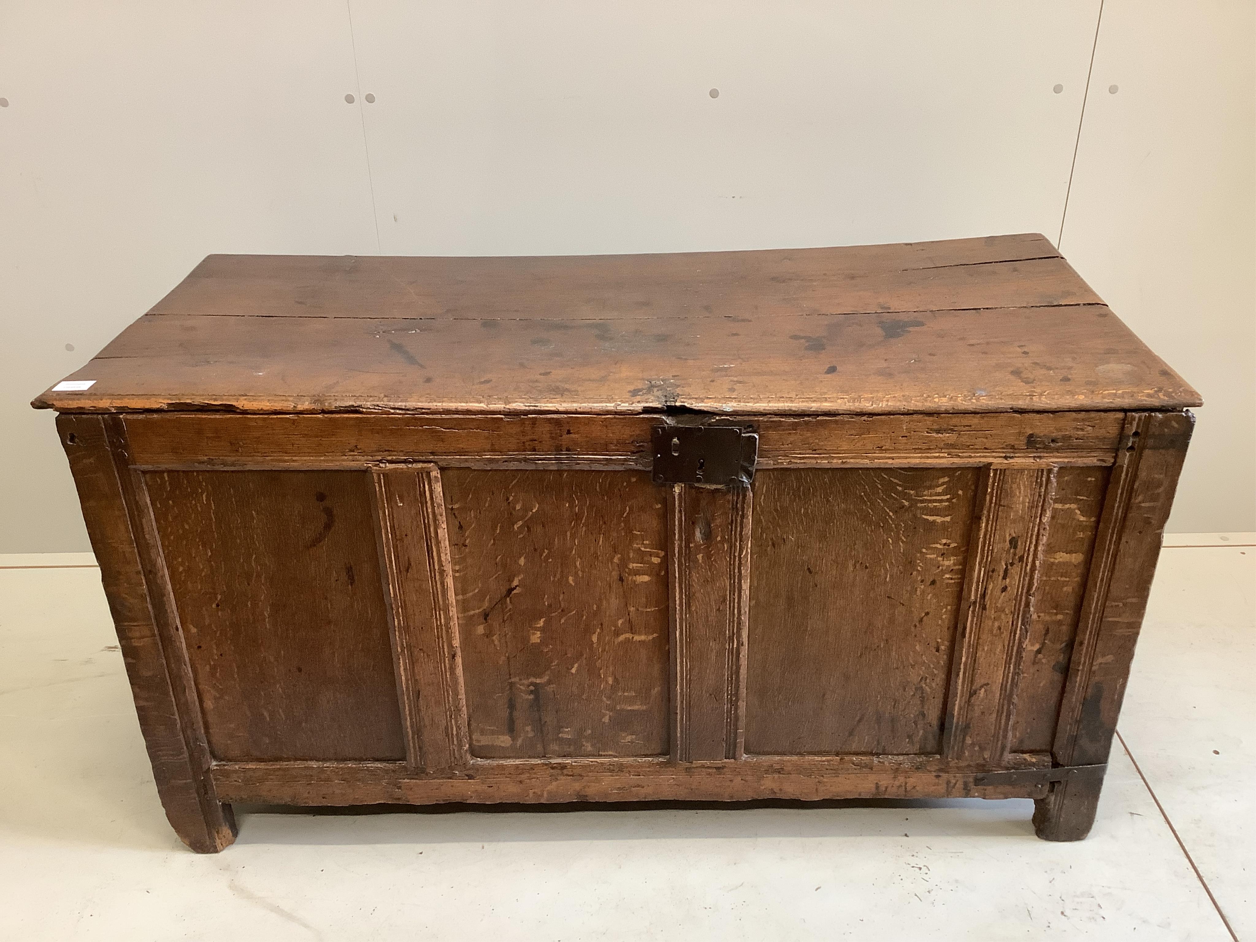 A late 17th century oak coffer with panelled front, width 135cm, depth 59cm, height 72cm. Condition - poor to fair